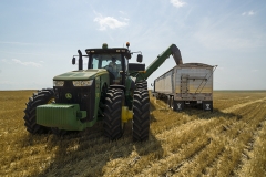 Grain trailer in the field with a tractor