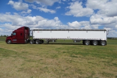 Red semi with white trailer in Grand Forks, ND