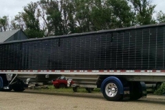 Black trailer on blue semi-truck in Bismarck, ND