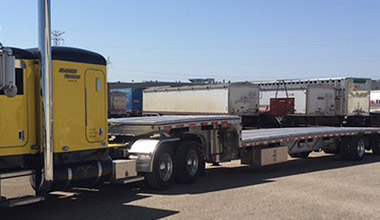 Yellow Truck with trailer parts in Bismark 