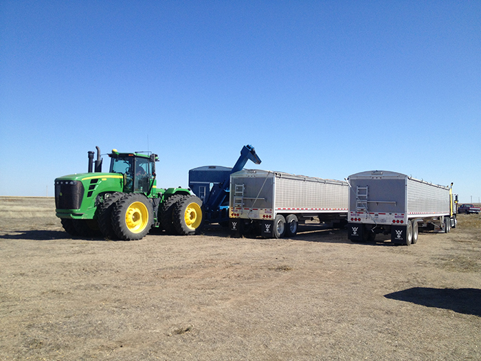 Tractor hauling trailer parts in Fargo, ND