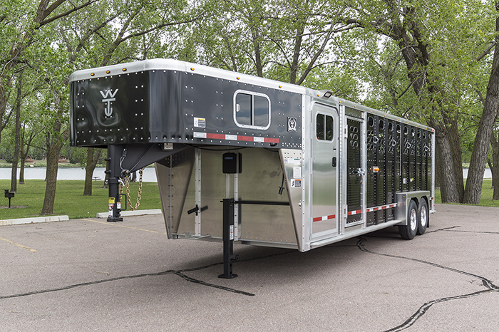 a trailer in a parking lot featuring Livestock Trailers and Dry Van Trailers in Minot, ND