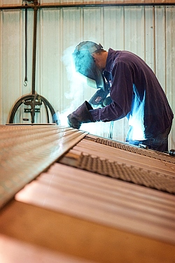 Man performing Trailer Service in a Trailer Repair Shop in Fargo and Bismarck, Serving Grand Forks, Minot